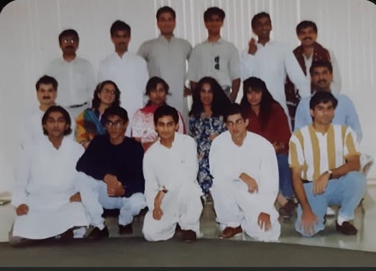 Group photograph of about eighteen PSA members in 1992, three rows, front row kneeling